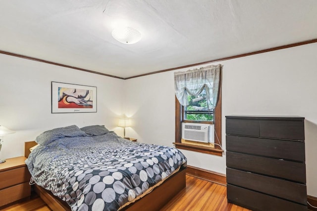 308 Forest St, Mount Horeb, WI 53572 - bedroom with wood finished floors, crown molding, cooling unit, and baseboards