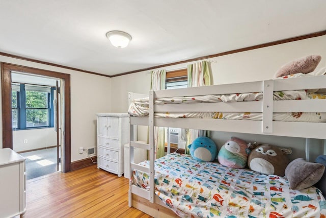 308 Forest St, Mount Horeb, WI 53572 - bedroom with crown molding, light wood finished floors, and baseboards