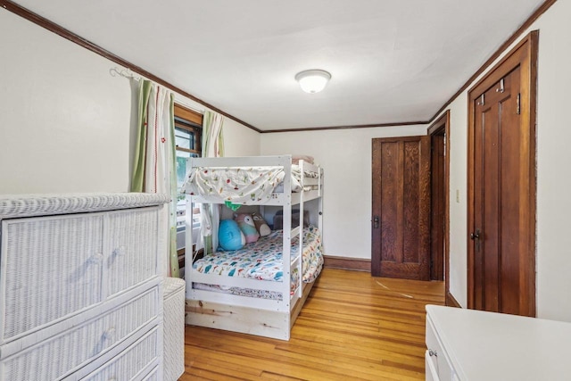 308 Forest St, Mount Horeb, WI 53572 - bedroom featuring light wood-type flooring, crown molding, and baseboards