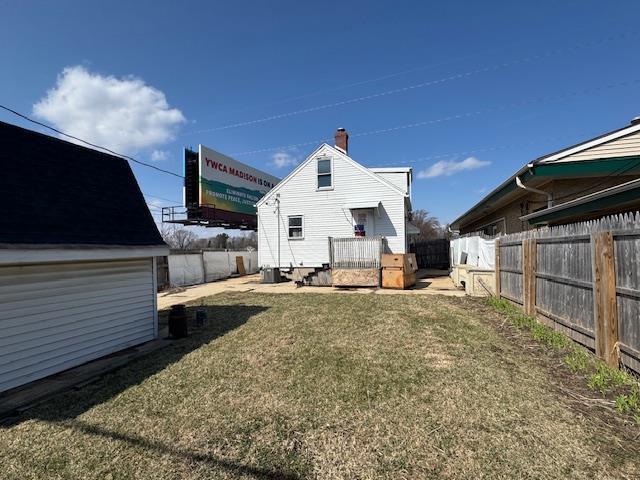 4273 W Beltline Hwy, Madison, WI 53711 - back of property with a lawn and a fenced backyard