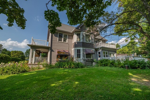 3720 County Highway Nn, West Bend, WI 53095 - back of property featuring a balcony and a yard