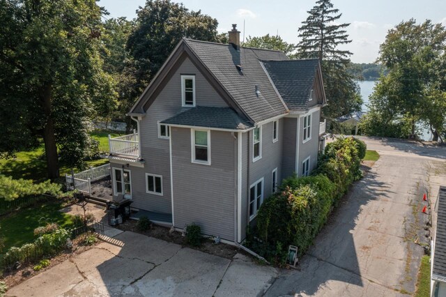 3720 County Highway Nn, West Bend, WI 53095 - view of property exterior featuring roof with shingles and a chimney