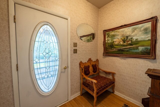 3720 County Highway Nn, West Bend, WI 53095 - foyer featuring wallpapered walls, baseboards, and wood finished floors