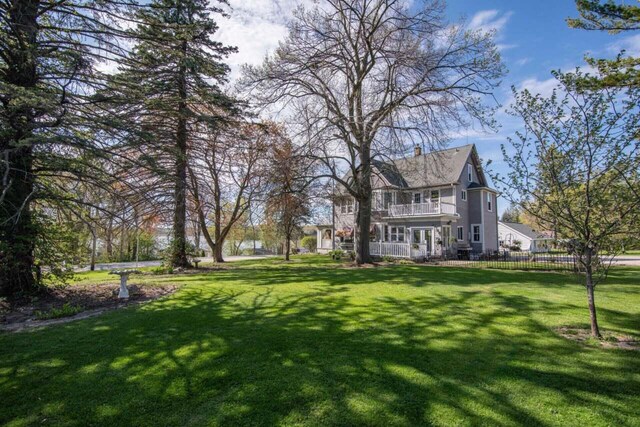 3720 County Highway Nn, West Bend, WI 53095 - view of yard with a balcony and fence