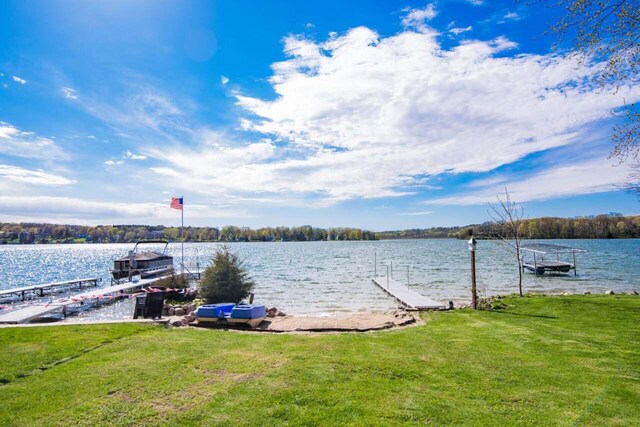 3720 County Highway Nn, West Bend, WI 53095 - view of dock featuring a lawn and a water view