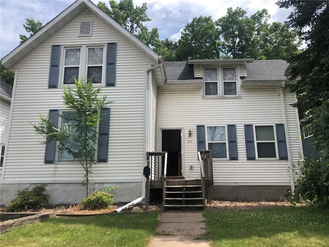 609 S Dewey St, Eau Claire, WI 54701 - view of front of house featuring a front yard and a shingled roof