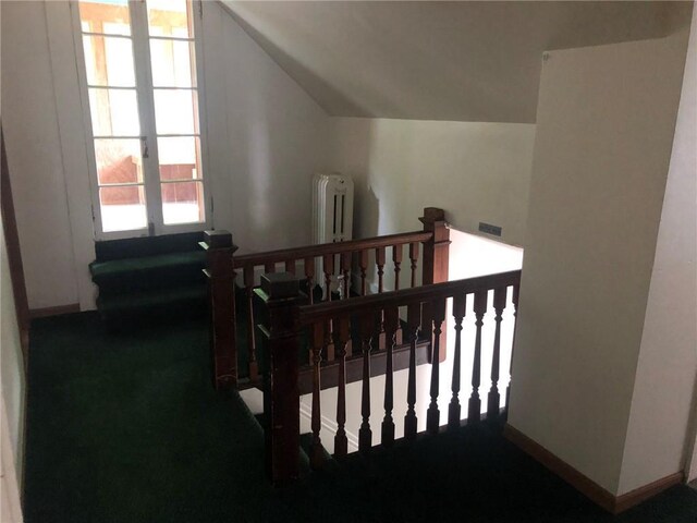 609 S Dewey St, Eau Claire, WI 54701 - bedroom with baseboards, lofted ceiling, visible vents, and radiator heating unit