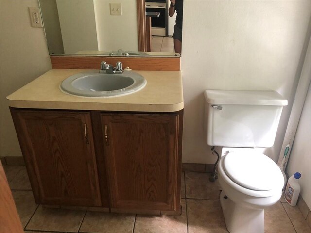 609 S Dewey St, Eau Claire, WI 54701 - bathroom featuring toilet, tile patterned flooring, and vanity