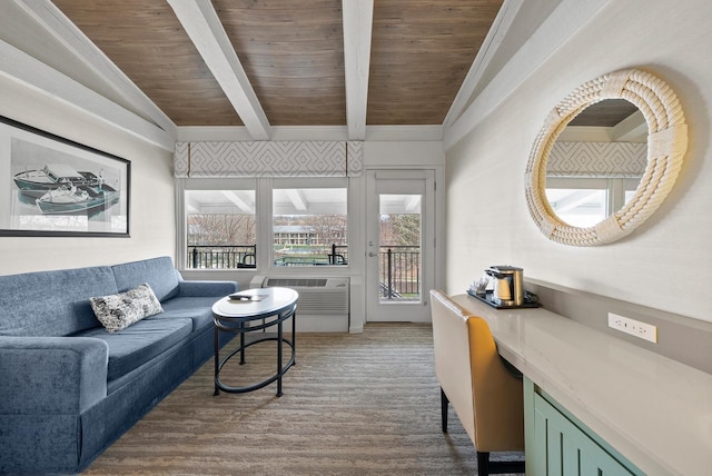 living area with wooden ceiling, beamed ceiling, wood finished floors, and plenty of natural light