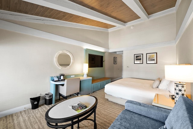 carpeted bedroom with baseboards, wooden ceiling, and lofted ceiling with beams