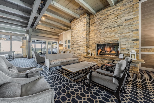 living room with a fireplace, beamed ceiling, and wooden ceiling