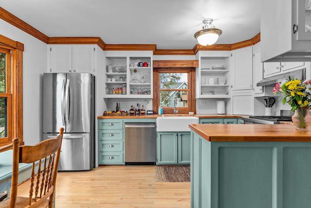 2346 Hickory Ln, Oshkosh, WI 54901 - kitchen with a sink, open shelves, green cabinets, wooden counters, and stainless steel appliances