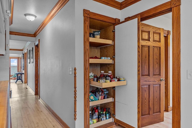 2346 Hickory Ln, Oshkosh, WI 54901 - corridor featuring baseboards, light wood-style flooring, and crown molding