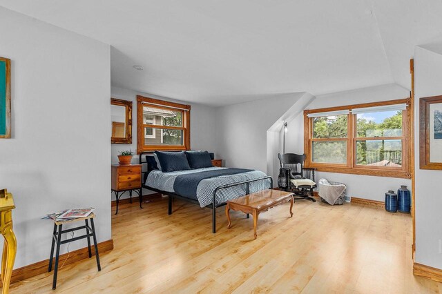 2346 Hickory Ln, Oshkosh, WI 54901 - bedroom with baseboards, lofted ceiling, and wood finished floors
