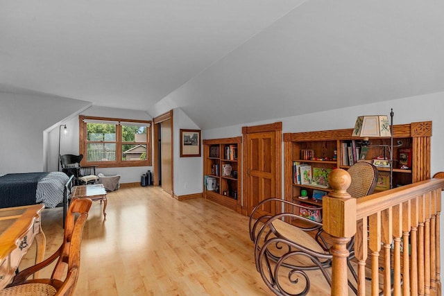 2346 Hickory Ln, Oshkosh, WI 54901 - office area featuring baseboards, lofted ceiling, and light wood-type flooring