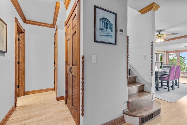 2346 Hickory Ln, Oshkosh, WI 54901 - hall featuring ornamental molding, baseboards, light wood-style floors, and stairs