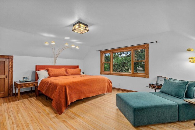 2346 Hickory Ln, Oshkosh, WI 54901 - bedroom with vaulted ceiling and light wood finished floors