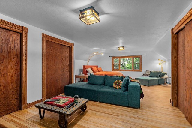 2346 Hickory Ln, Oshkosh, WI 54901 - living area with vaulted ceiling and hardwood / wood-style floors