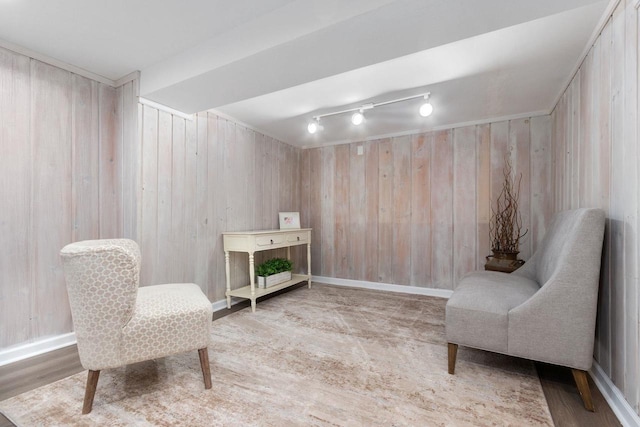 2346 Hickory Ln, Oshkosh, WI 54901 - sitting room with baseboards, wooden walls, and wood finished floors