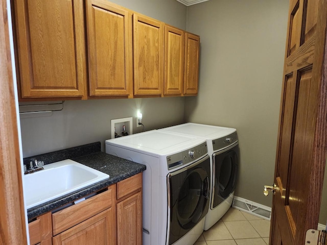 1579 Foxfire Ct, Waupaca, WI 54981 - laundry room with baseboards, light tile patterned flooring, cabinet space, washer and dryer, and a sink