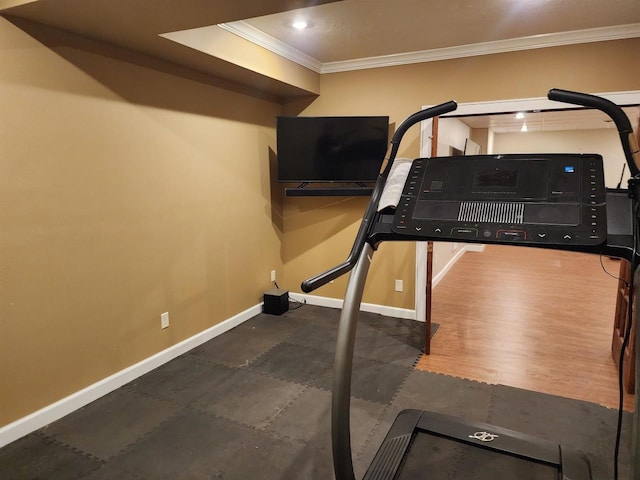1579 Foxfire Ct, Waupaca, WI 54981 - workout room featuring baseboards, ornamental molding, and wood finished floors