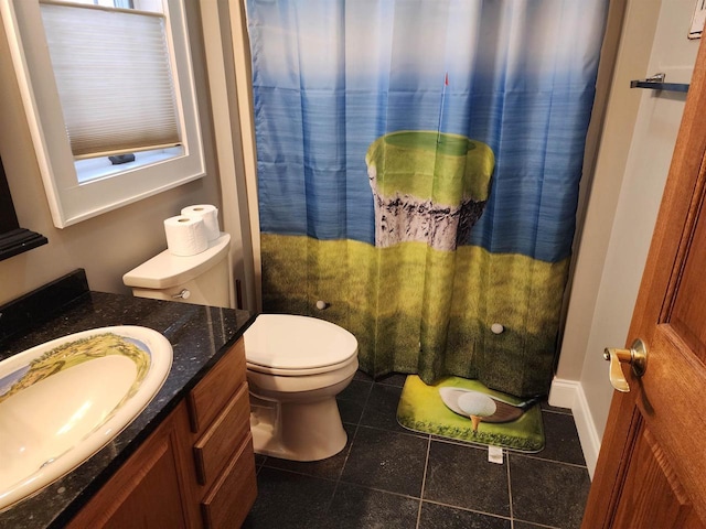 1579 Foxfire Ct, Waupaca, WI 54981 - bathroom with baseboards, a shower with shower curtain, toilet, vanity, and tile patterned floors