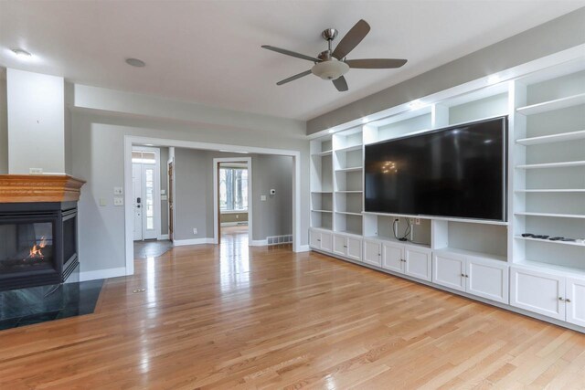 1579 Foxfire Ct, Waupaca, WI 54981 - unfurnished living room with visible vents, ceiling fan, light wood-style floors, and baseboards