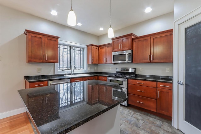 1579 Foxfire Ct, Waupaca, WI 54981 - kitchen with pendant lighting, recessed lighting, a center island, appliances with stainless steel finishes, and a sink