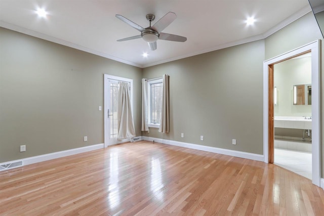1579 Foxfire Ct, Waupaca, WI 54981 - unfurnished bedroom with visible vents, crown molding, and light wood-style flooring