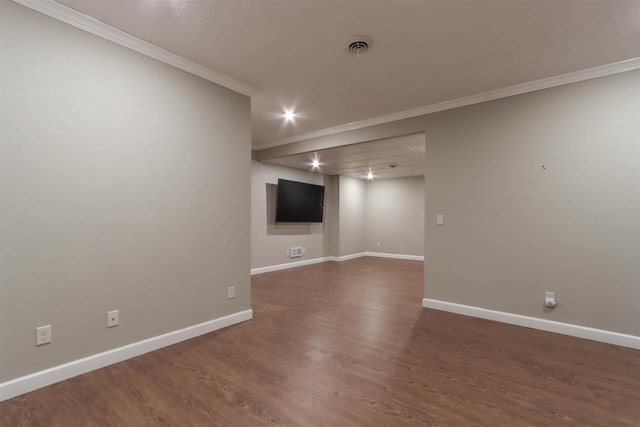 1579 Foxfire Ct, Waupaca, WI 54981 - unfurnished room with crown molding, visible vents, baseboards, and wood finished floors