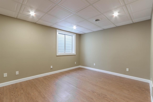 1579 Foxfire Ct, Waupaca, WI 54981 - spare room with a paneled ceiling, light wood finished floors, baseboards, and visible vents
