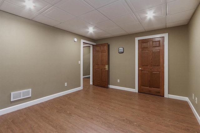 1579 Foxfire Ct, Waupaca, WI 54981 - spare room featuring visible vents, baseboards, light wood finished floors, and a drop ceiling