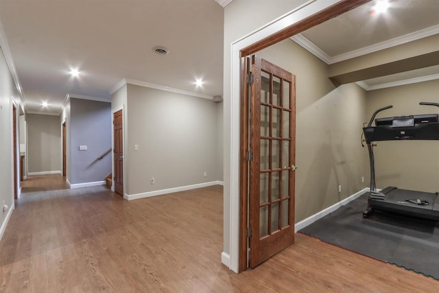 1579 Foxfire Ct, Waupaca, WI 54981 - exercise area featuring crown molding, wood finished floors, and baseboards