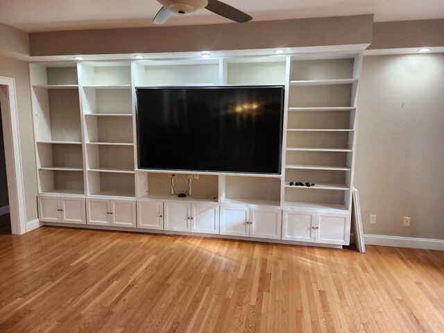 1579 Foxfire Ct, Waupaca, WI 54981 - unfurnished living room with light wood-style flooring, baseboards, and a ceiling fan
