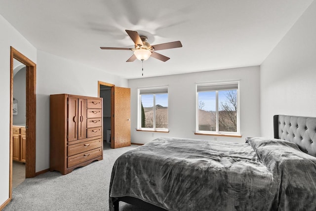 bedroom with light carpet and ceiling fan