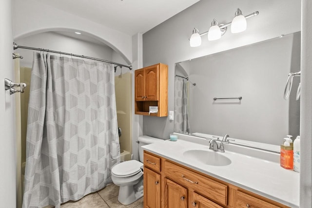 full bathroom with toilet, tile patterned floors, shower / bathtub combination with curtain, and vanity