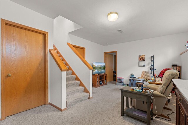 509 Meadow View Rd, Mount Horeb, WI 53572 - living room with light carpet, visible vents, and stairs