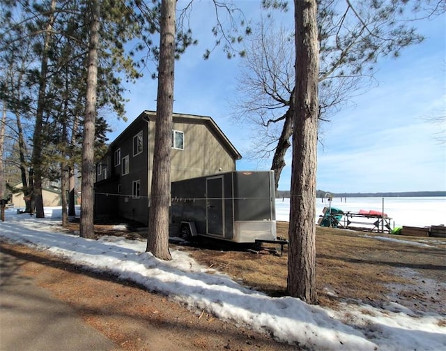 7744 Otte Dr Unit 1, Hayward, WI 54843 - view of side of property with a sunroom and a water view