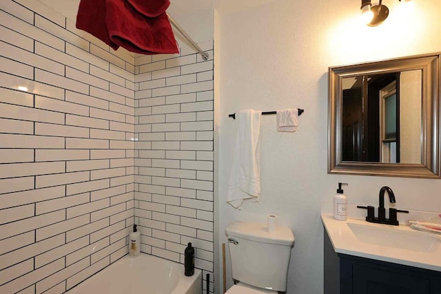 full bath with toilet, vanity, and bathing tub / shower combination