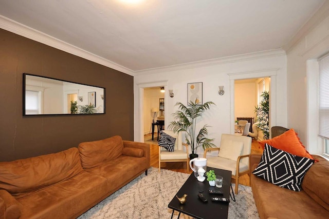 living room with crown molding and wood finished floors