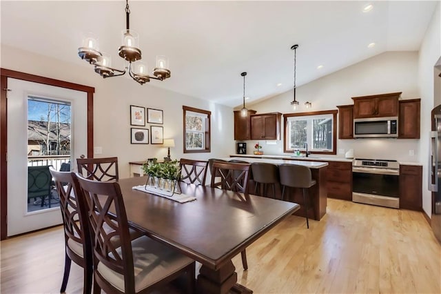 820 Rusty Ct, Altoona, WI 54720 - dining area with light wood-style floors, lofted ceiling, a chandelier, and recessed lighting
