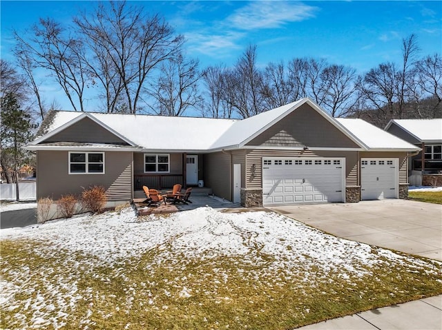 820 Rusty Ct, Altoona, WI 54720 - ranch-style house featuring an attached garage, concrete driveway, and stone siding