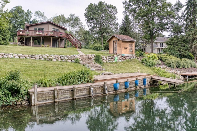 W5854 Bubbling Springs Dr, Elkhorn, WI 53121 - dock area featuring a yard, a deck with water view, and stairway