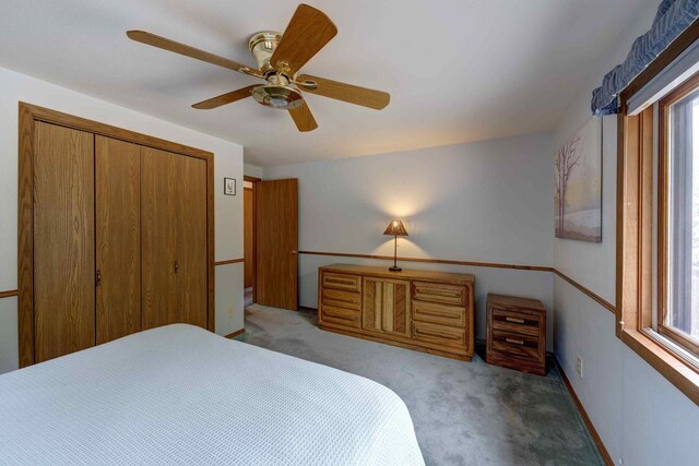 W5854 Bubbling Springs Dr, Elkhorn, WI 53121 - carpeted bedroom with a closet, baseboards, and a ceiling fan