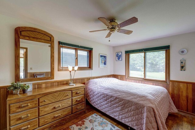W5854 Bubbling Springs Dr, Elkhorn, WI 53121 - bedroom with wood walls, a wainscoted wall, and wood finished floors