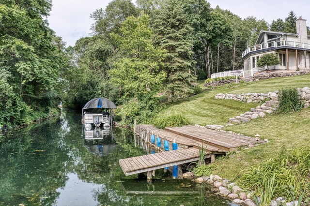 W5854 Bubbling Springs Dr, Elkhorn, WI 53121 - view of dock with a water view and a yard
