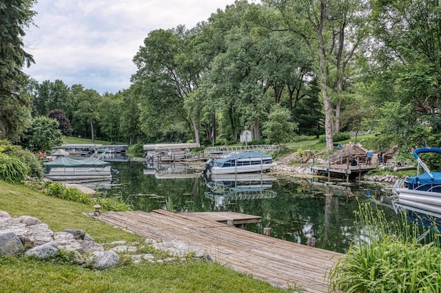 W5854 Bubbling Springs Dr, Elkhorn, WI 53121 - view of dock with a wooded view and a water view