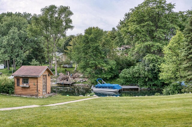 W5854 Bubbling Springs Dr, Elkhorn, WI 53121 - view of yard with a storage shed, a boat dock, and an outbuilding
