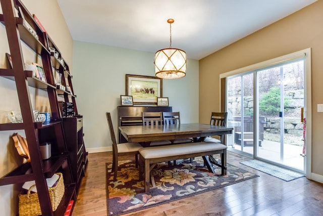 6679 S Chickahauk Trl, Middleton, WI 53562 - dining area with a notable chandelier, baseboards, and wood finished floors