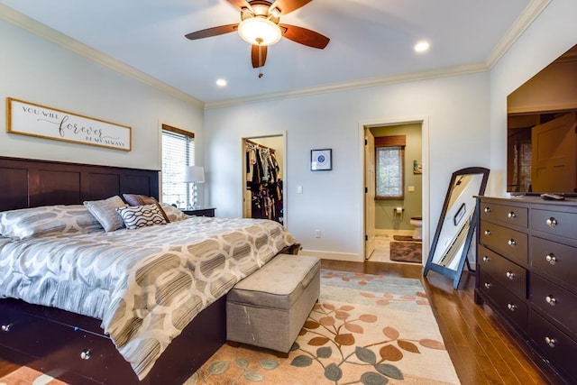 6679 S Chickahauk Trl, Middleton, WI 53562 - bedroom featuring a closet, crown molding, wood finished floors, a spacious closet, and baseboards